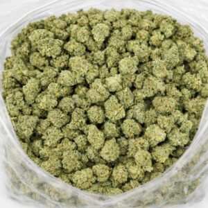 yoda cannabis flower buds in an open bag, showing small dense nugs with light green tones and frosty trichome coverage